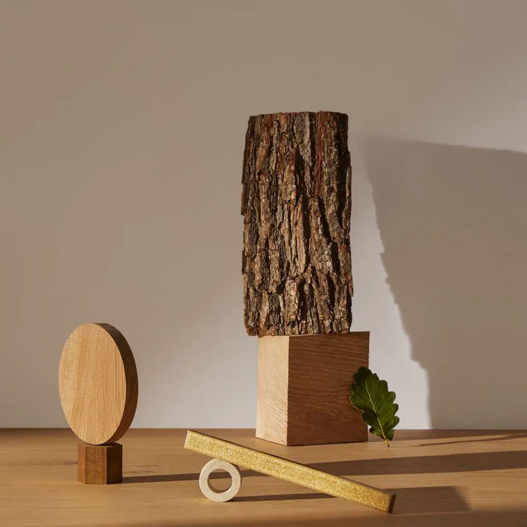 piece of wood sitting on top of a wooden table